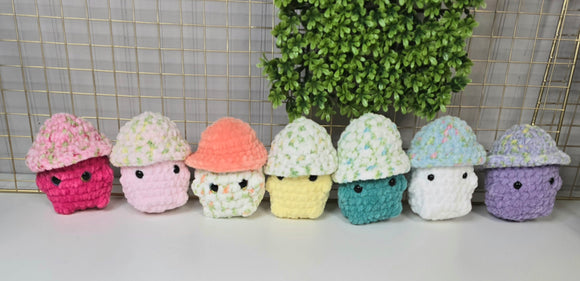 Crochet Mushie Plushies in a variety of color combinations.