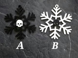 black and white snowflake ornament with skull in the center